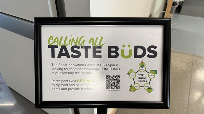 a sign in a stand that says "calling all taste buds"