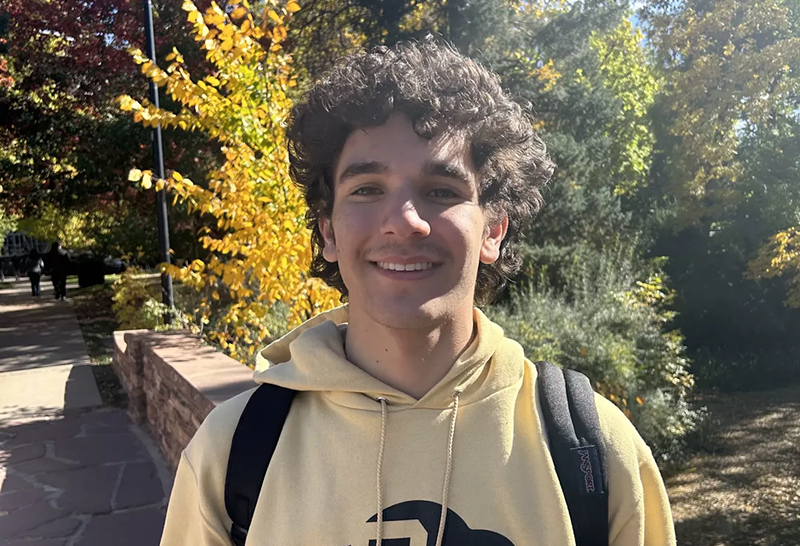 Image: Manny Pargman wearing a CU Boulder hoodie.