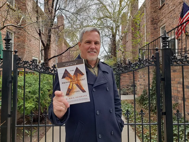 Image: D. Eric Maikranz and his novel at home in Denver.
