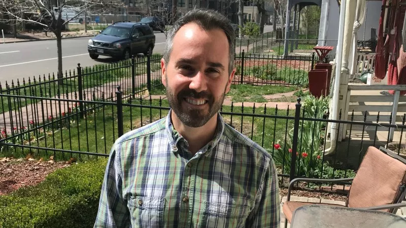Image: Dan Baer in front of his home in Five Points.