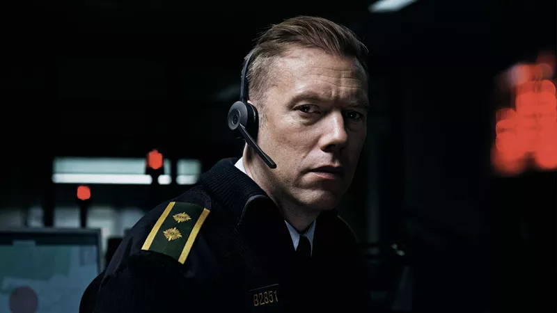 Image: In Danish director Gustav Möller’s The Guilty, Jakob Cedergren plays Asger Holm, a police officer who has been temporarily demoted to working the phones and is on the line with a woman who is being abducted by her ex-husband.