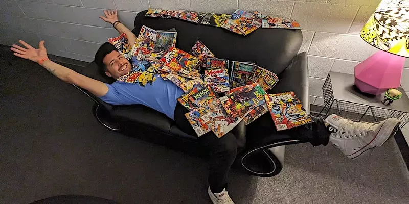 Image: Cliff Thompson, owner of Danny the Comic Shop, stretches out with some friends.