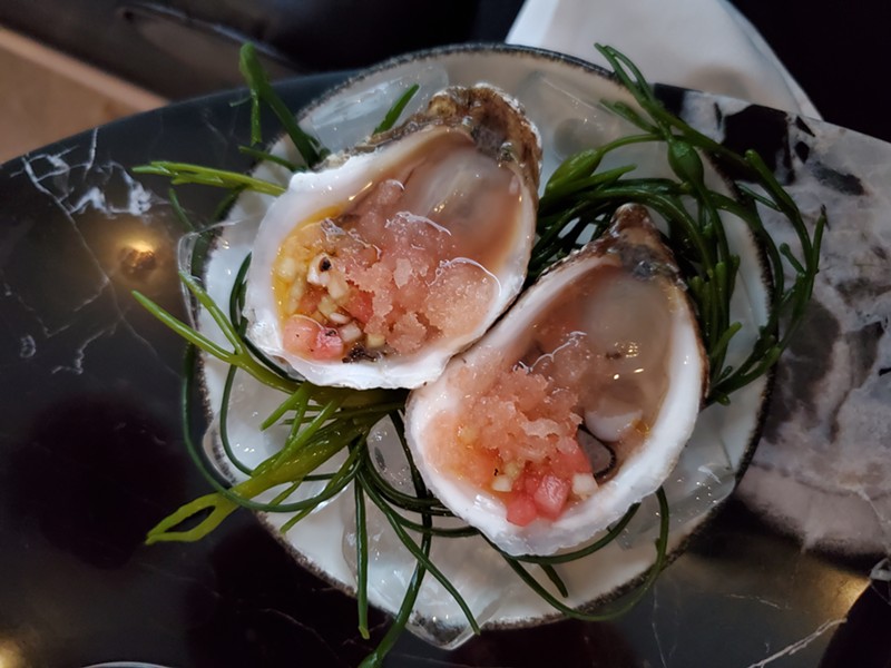 Kick off your date night with oysters topped with watermelon granita.
