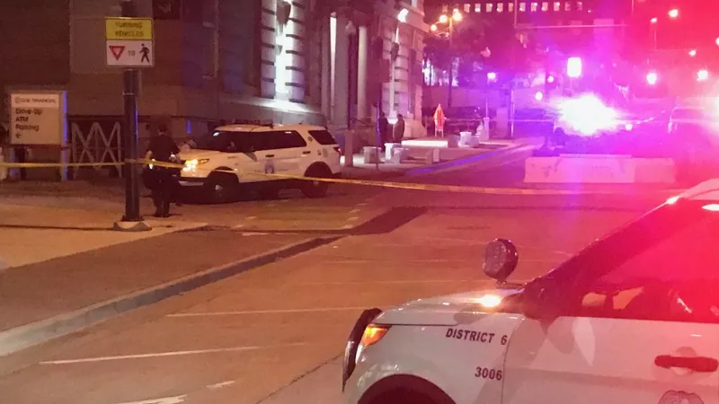 Image: Denver police officers at the scene of a death just off 16th Street before 6 a.m. on August 27.