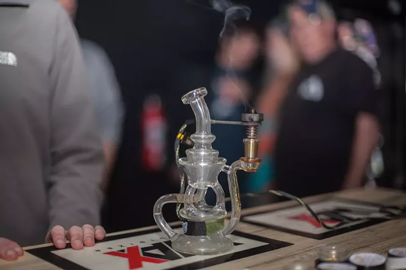 Image: A dab ring burns inside the Honey Pot Lounge, a now-closed marijuana social consumption lounge in Denver.