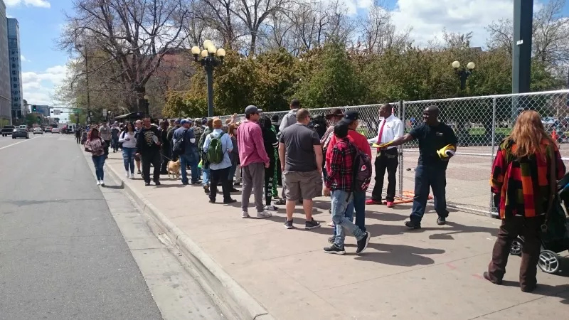 Image: The line to enter Civic Center Park for the Denver 420 Rally was long even before the rains came.
