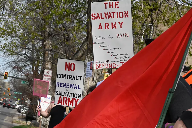 Image: Signs protest the Salvation Army.