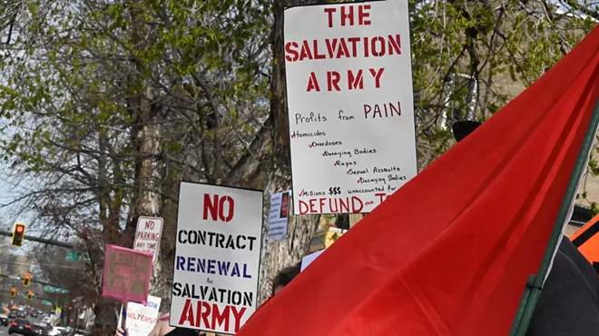Signs protest the Salvation Army.