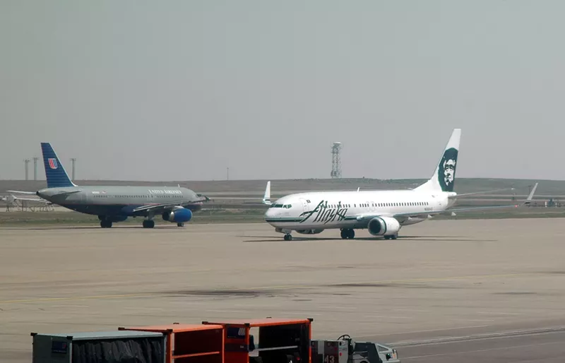 Image: grounded united airlines and alaskan airlines planes on runway