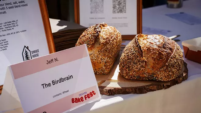 Two loaves of bread next to a sign reading "The Birdbrain,"