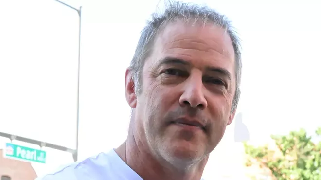 A man looks at the camera.