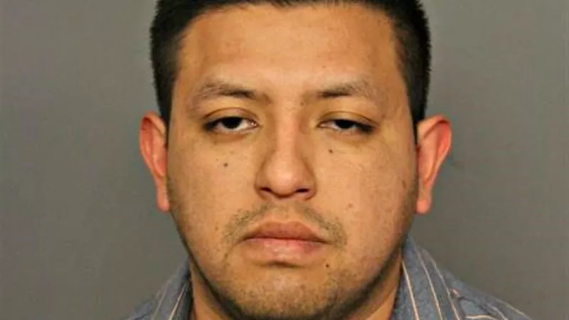 Image: The booking photo of Denver police officer Johnny Leon-Alvarez.