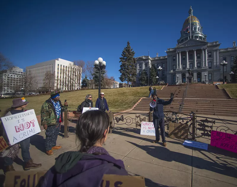 Image: Jerry Burton speaking at a rally to strike down the camping ban on Friday, December 20.