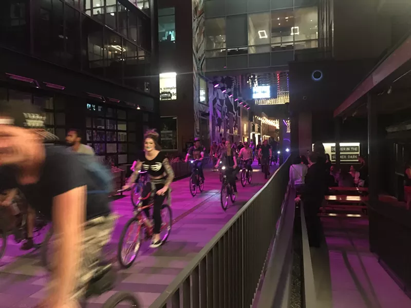 Image: Denver Cruiser Ride reaches the Dairy Block alley.