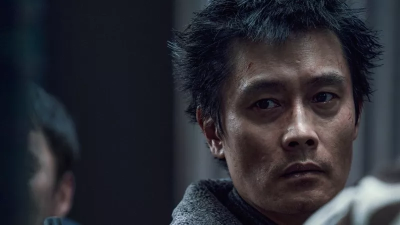 Image: man looking to his right with a sad expression