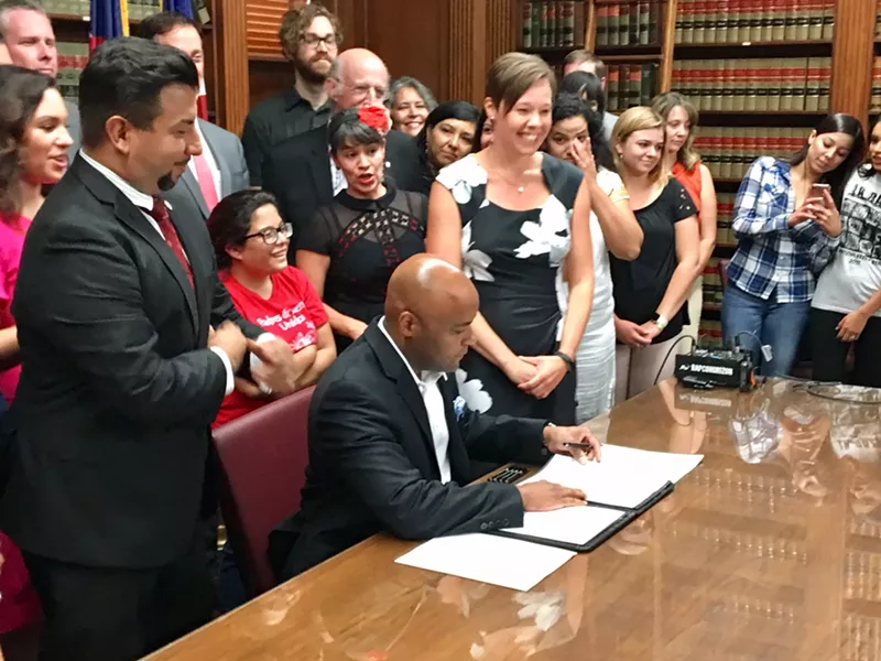 Image: Mayor Michael Hancock at the bill signing on August 31.