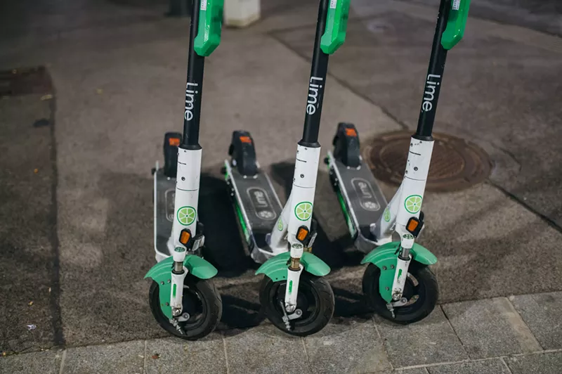 Image: Lime scooters parked on curb