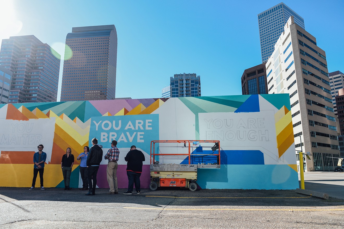 Members of the Find Your Words campaign, Tennyson Center for Children and Kaiser Permanente Colorado stand in front of their half-completed mural on Thursday, October 12.