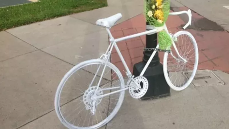Image: A ghost bike monument, left at a Denver-area location near where a cyclist died.