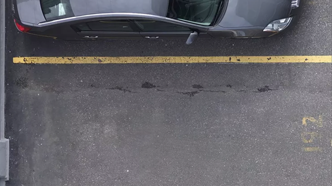 empty parking spot between two parked cars