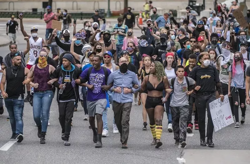 Image: Marchers during a May 30 rally in downtown Denver.