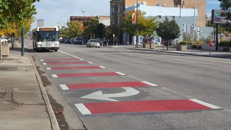 Image: Adding paint to turn lanes is a low-cost, traffic-calming strategy endorsed by Denver Streets Partnership.
