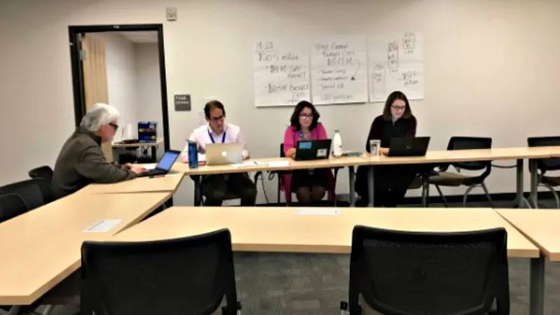 Image: This Twitter photo by Chalkbeat's Melanie Asmar had this caption: "After the room cleared out, Denver Superintendent Susana Cordova and the district negotiators returned. Cordova: 'We’re scheduled to negotiate from 5 until 8, and it's 7:30.'"