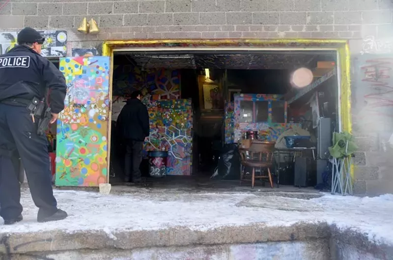Image: Denver police watched over artists leaving Rhinoceropolis on December 9.