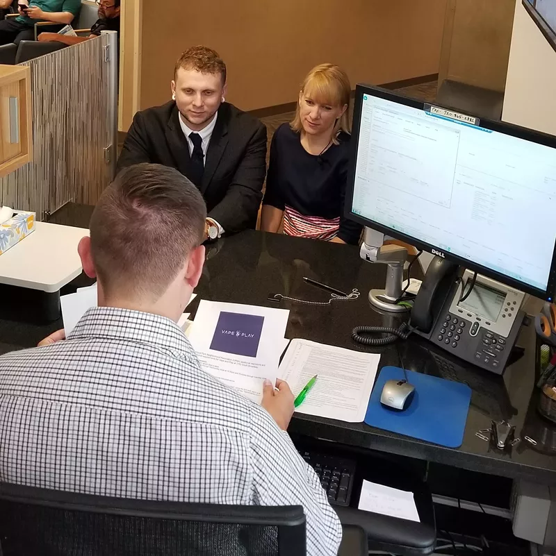 Image: Taylor Rosean and Megan Lumpkins submit their application for a Cannabis Consumption Establishment license on June 7.