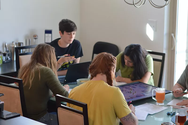 Image: Rachel Dove (black shirt) is a 35-year-old Denver resident and dungeon master who has played Dungeons & Dragons for almost seven years.