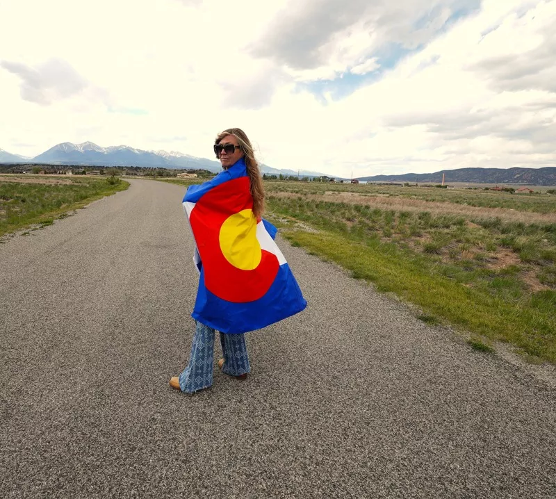 Image: A woman wearing a colorado flag
