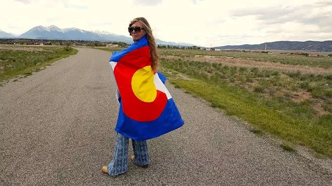 A woman wearing a colorado flag