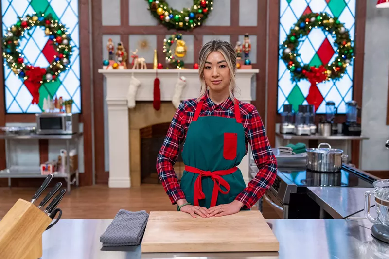 Image: woman in a red and white apron