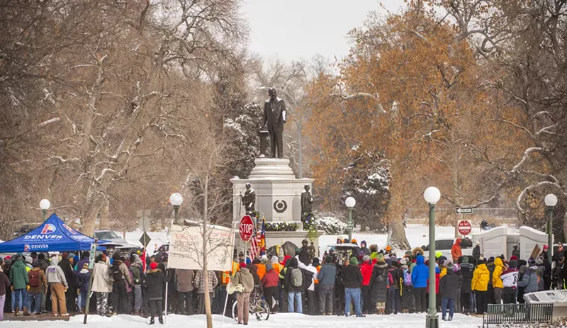 Image: group by MLK sculpture in snow