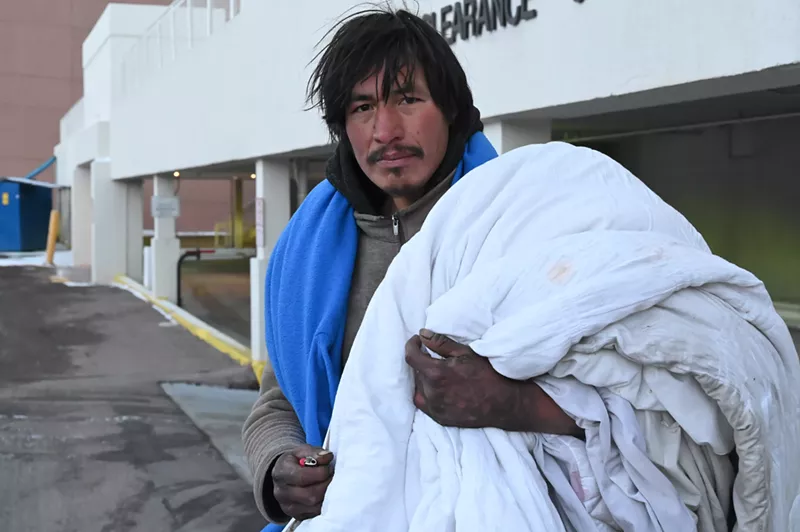 Image: A homeless resident looks for a warm place to sleep.