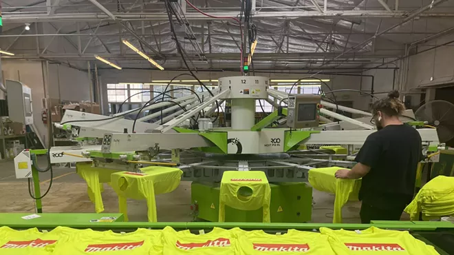 A worker in a print production shop.