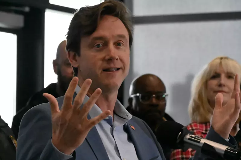Image: A man speaks.