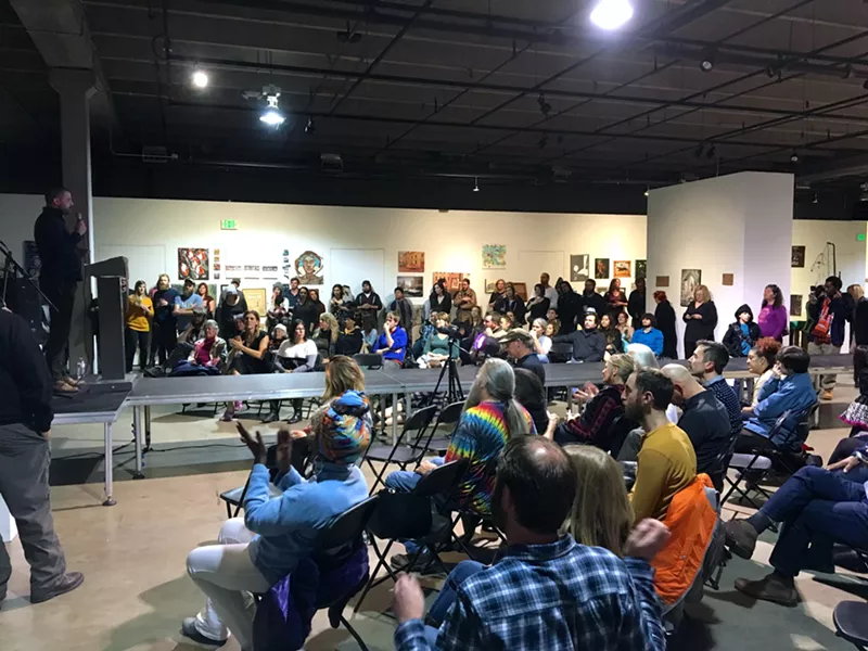 Image: A crowd listens to mayoral candidate Kayvan Khalatbari at Friday's "Move Along to Here!" event.
