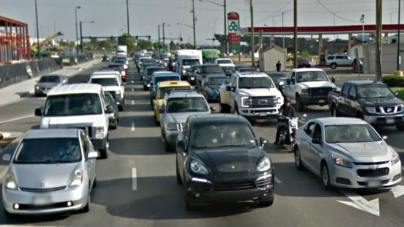 Image: Lines of traffic getting ready to brave the intersection at West Alameda Avenue and South Santa Fe Drive.