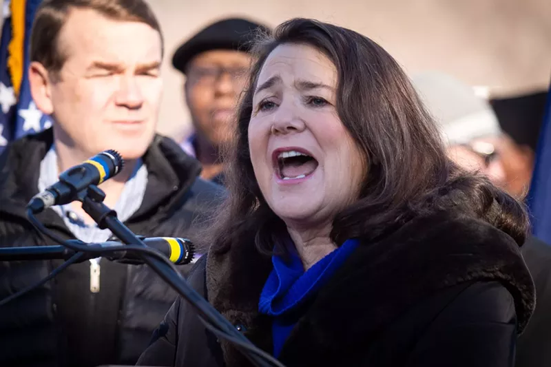 Image: Congresswoman Diana DeGette speaks at a Denver rally beside Senator Michael Bennet.