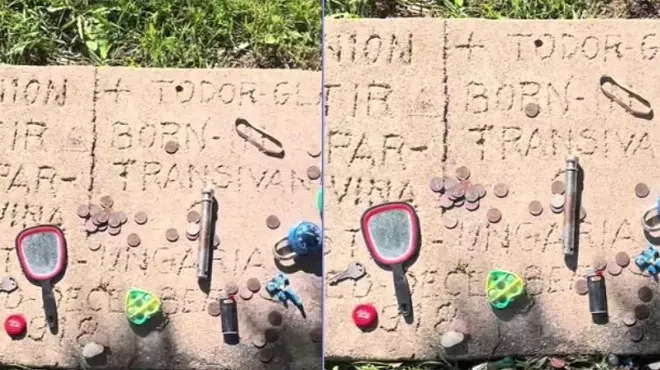 headstone in a cemetery with trinkets on it