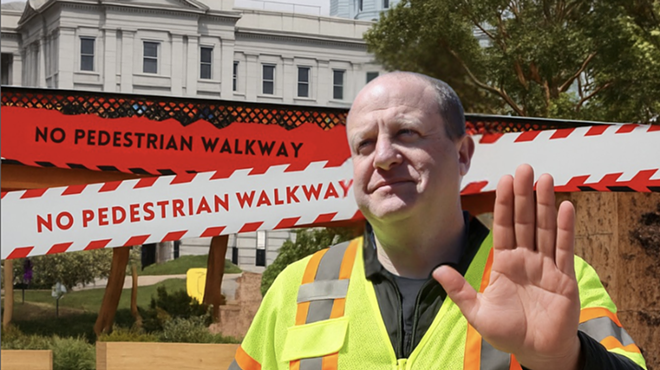 man in yellow work vest