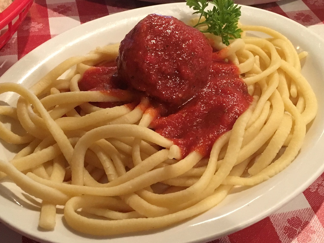 The "homemade noodles" plate at Dino's comes with sausage or a meatball and a side of extra sauce.