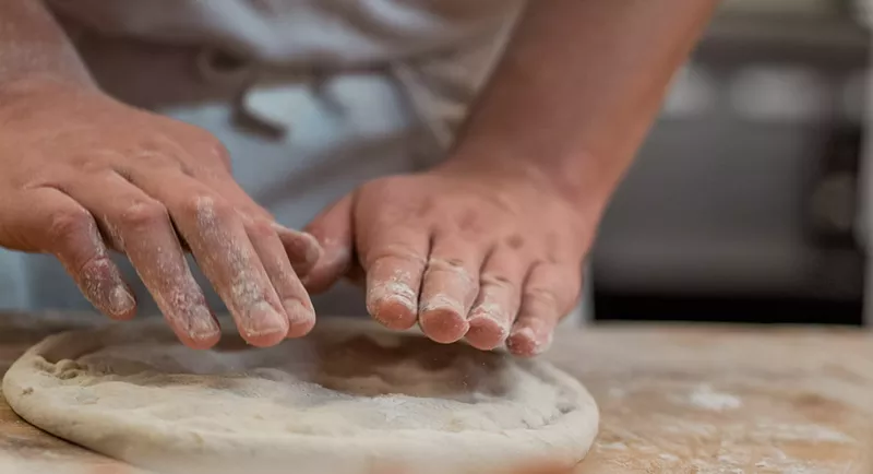 Image: High-protein heirloom flour goes into Redeemer's pizza dough.