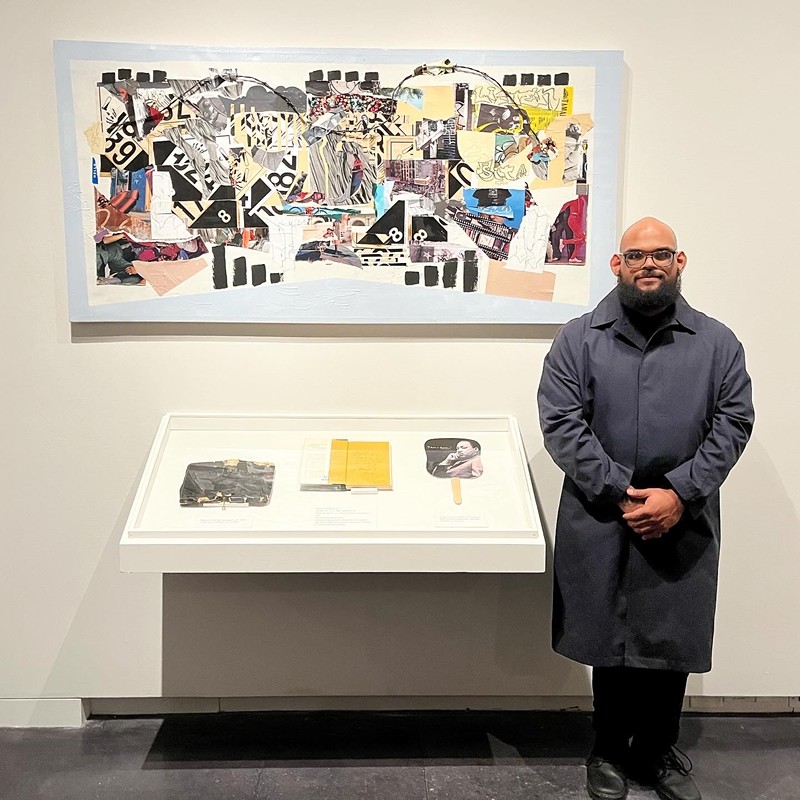 Devin Urioste stands alongside his artwork.