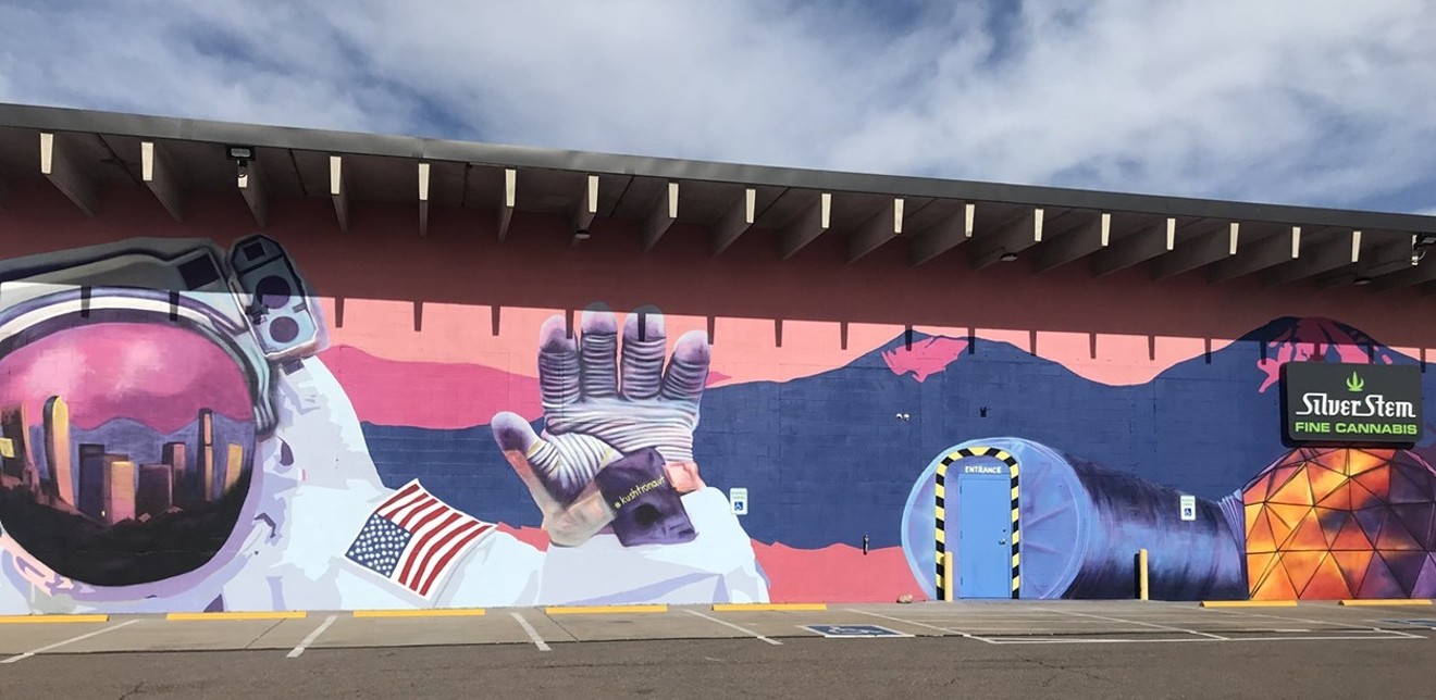 The mural is painted on the Silver Stem dispensary at 5275 Quebec Street, Commerce City.