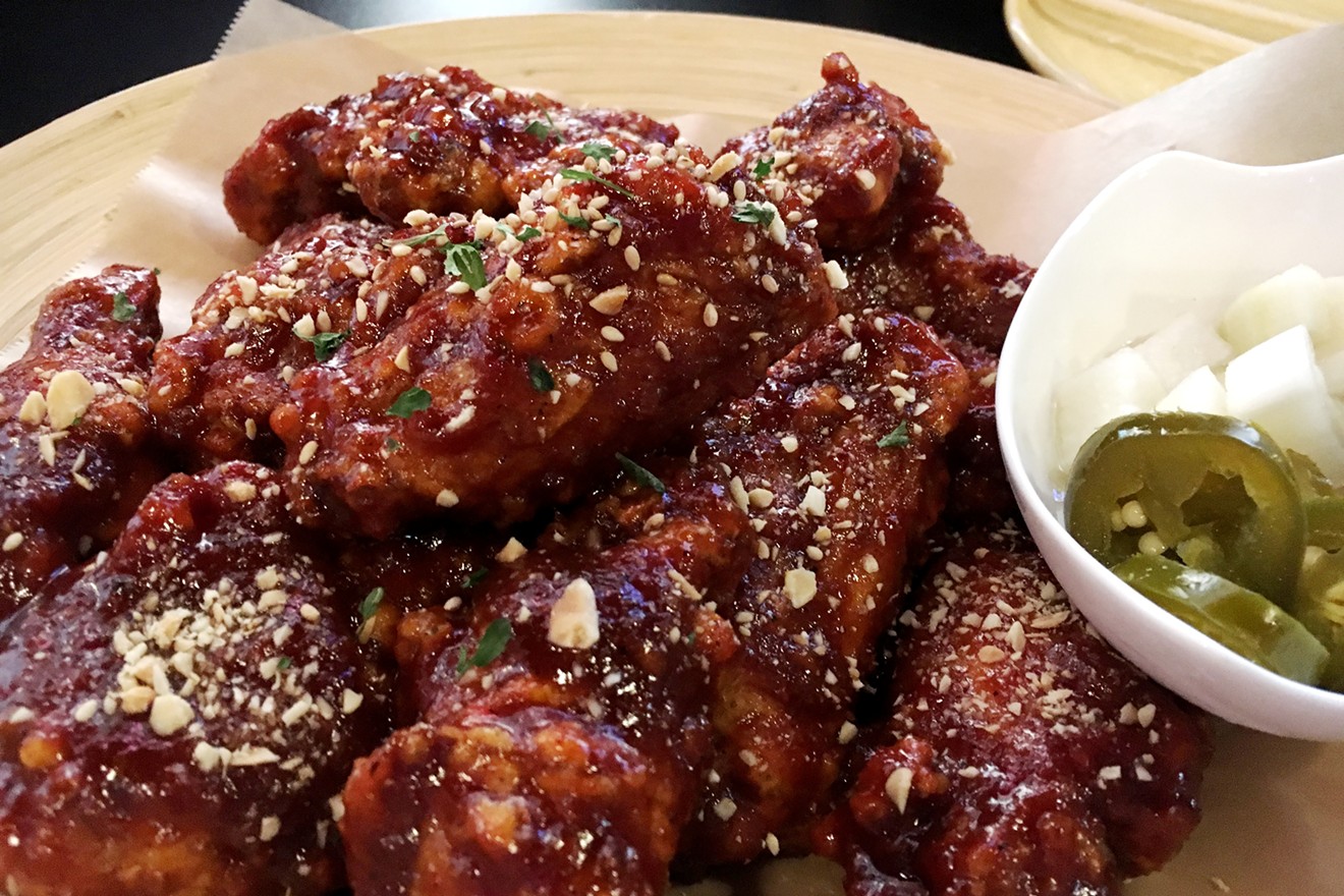 The wings at DMZ Pub are simultaneously crunchy and sticky.