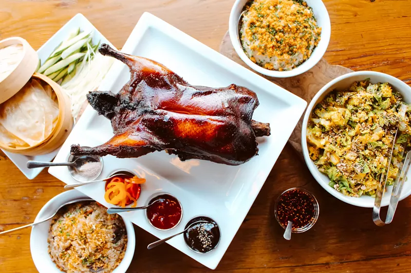 Image: A whole Peking duck, wild mushroom fried rice and other sides from Ace Eat Serve