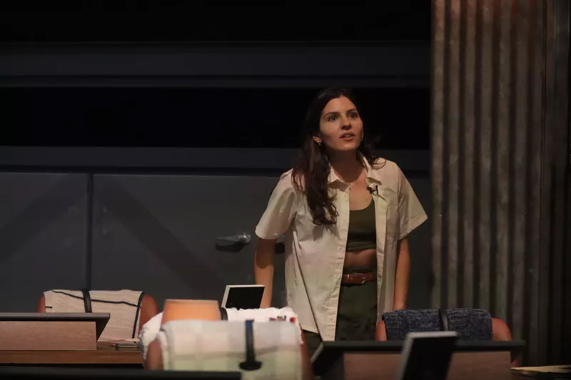 Image: Kelsey Nichols dressed in a green and beige hiking outfit at the Extracted headquarters.
