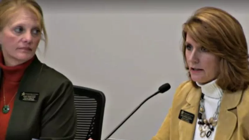 Image: Douglas County School Board secretary Krista Holtzmann and DCSB treasurer Anne-Marie Lemieux, seen at the December 4 meeting, were among those who voted to end the voucher program.